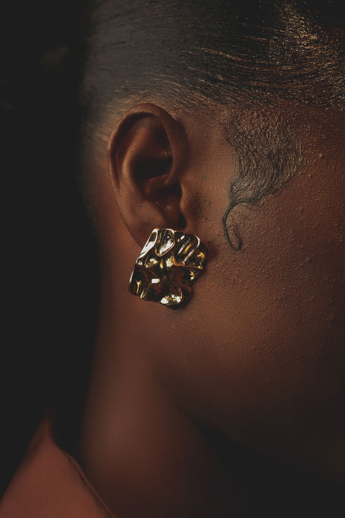 Pearl drop earring worn
