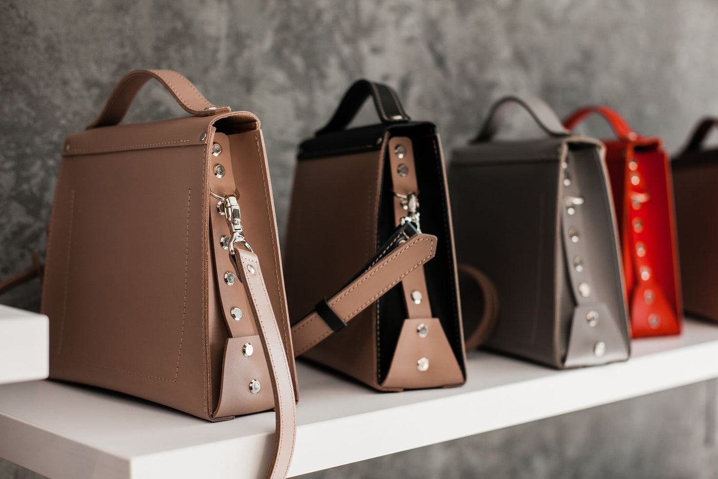 Leather clutch on a shelf